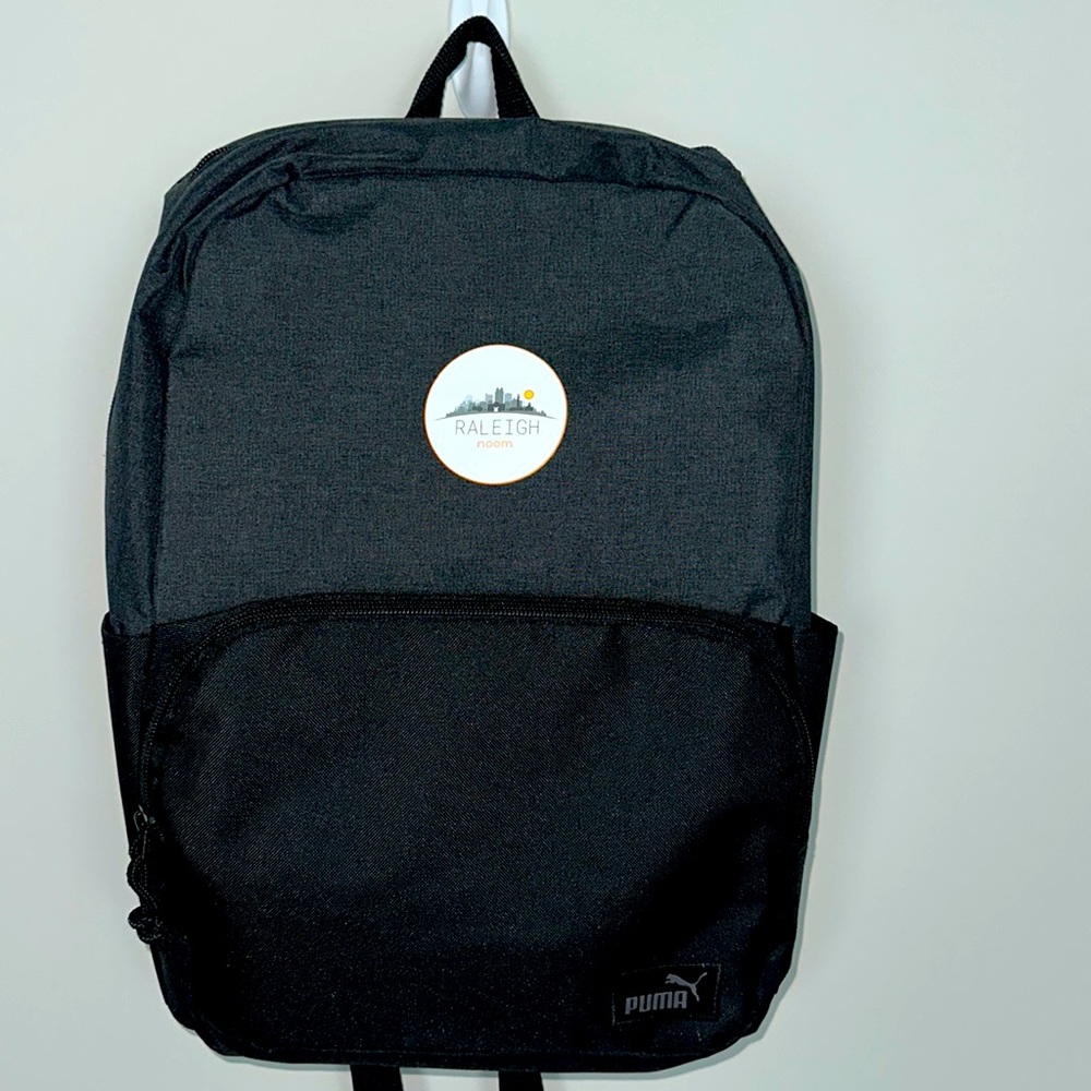 Puma black backpack with Noom Raleigh emblem